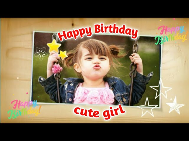 A baby girl laughing while holding a wrapped birthday gift Birthday Wishes for Baby Girl