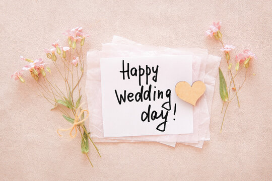 Happy Wedding Day card with a wooden heart and pink flowers Happy Wedding Day card with a wooden heart and pink flowers