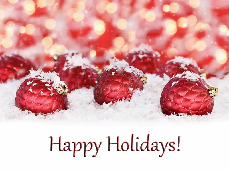 Happy Holidays with ornate glass Christmas ornaments and snowflakes on a red and gold bokeh background Happy Holidays with ornate glass Christmas ornaments and snowflakes on a red and gold bokeh background