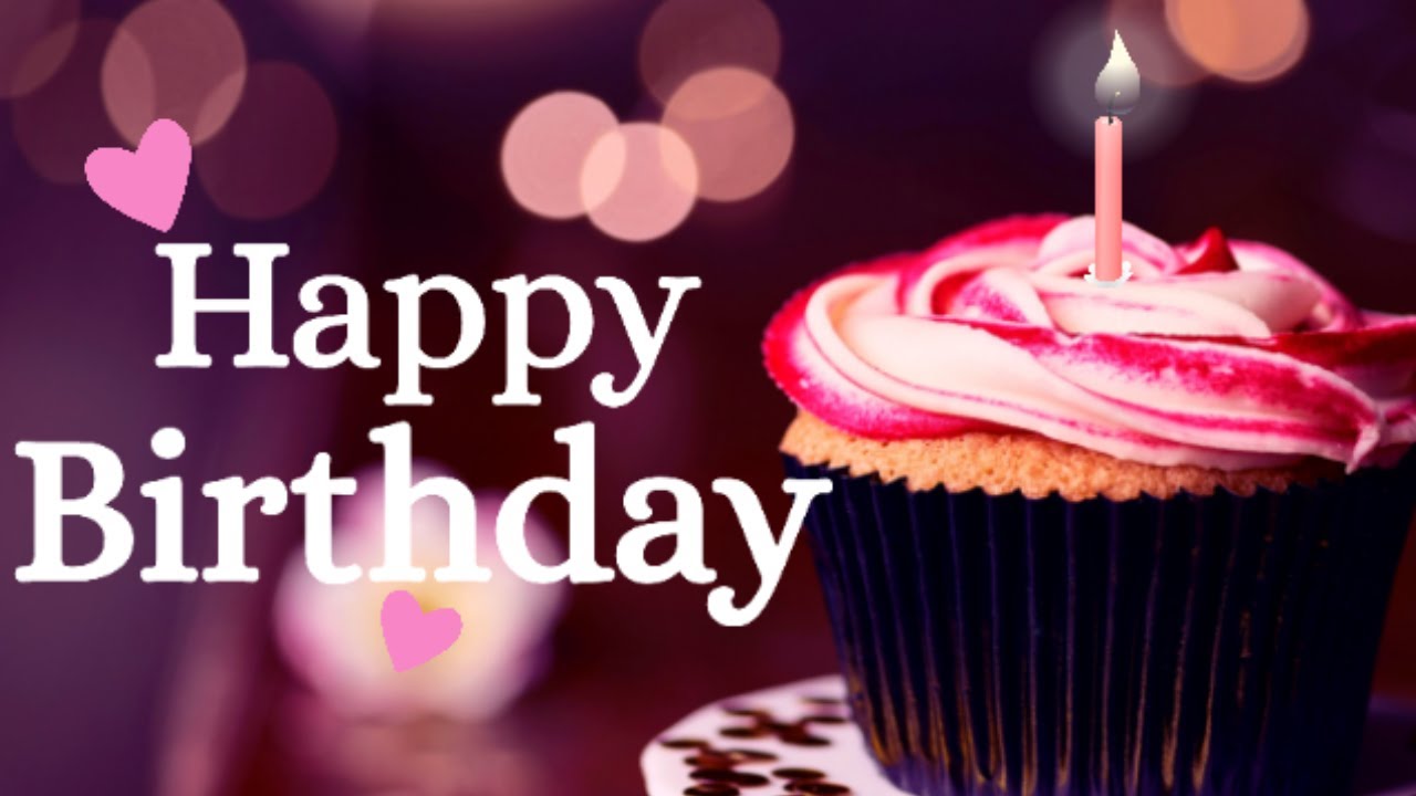 Besties laughing together while holding a birthday cake with candles Birthday Wishes for Bestie